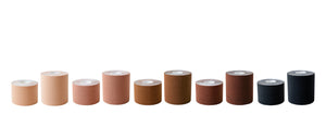Ten good lines boob tape rolls in five different colors side by side. From left to right is black, dark brown, brown, tan, and beige.