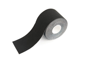 Black boob tape side view lightly unrolled.
